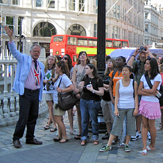 Explorica tour director leads a group 